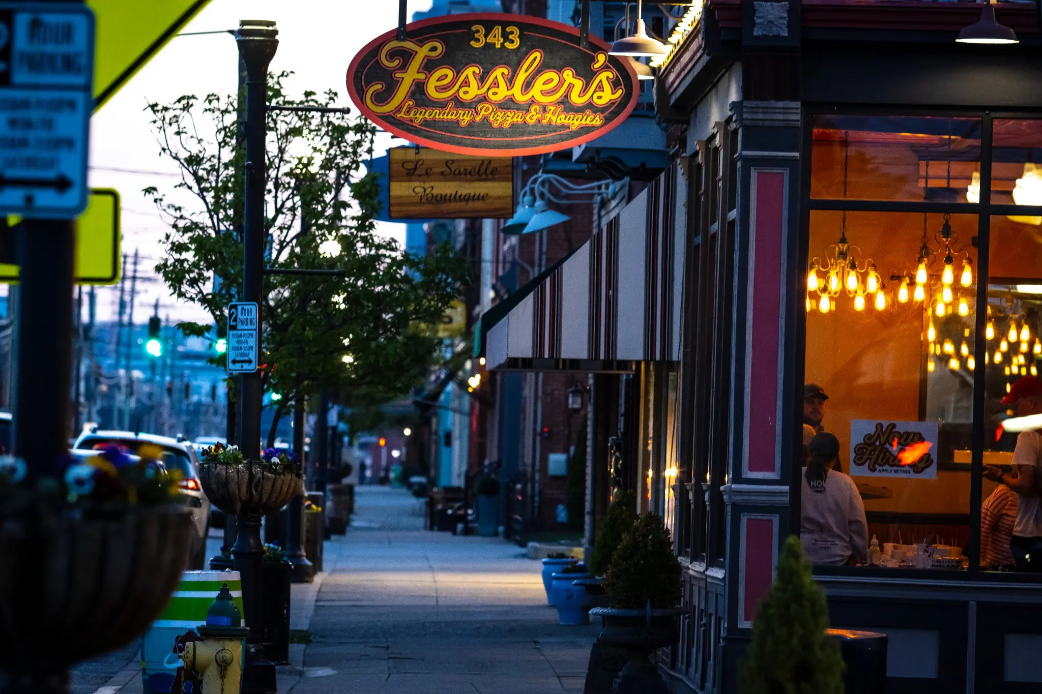 Fessler's restaurant and Bellevue streetscape in the evening