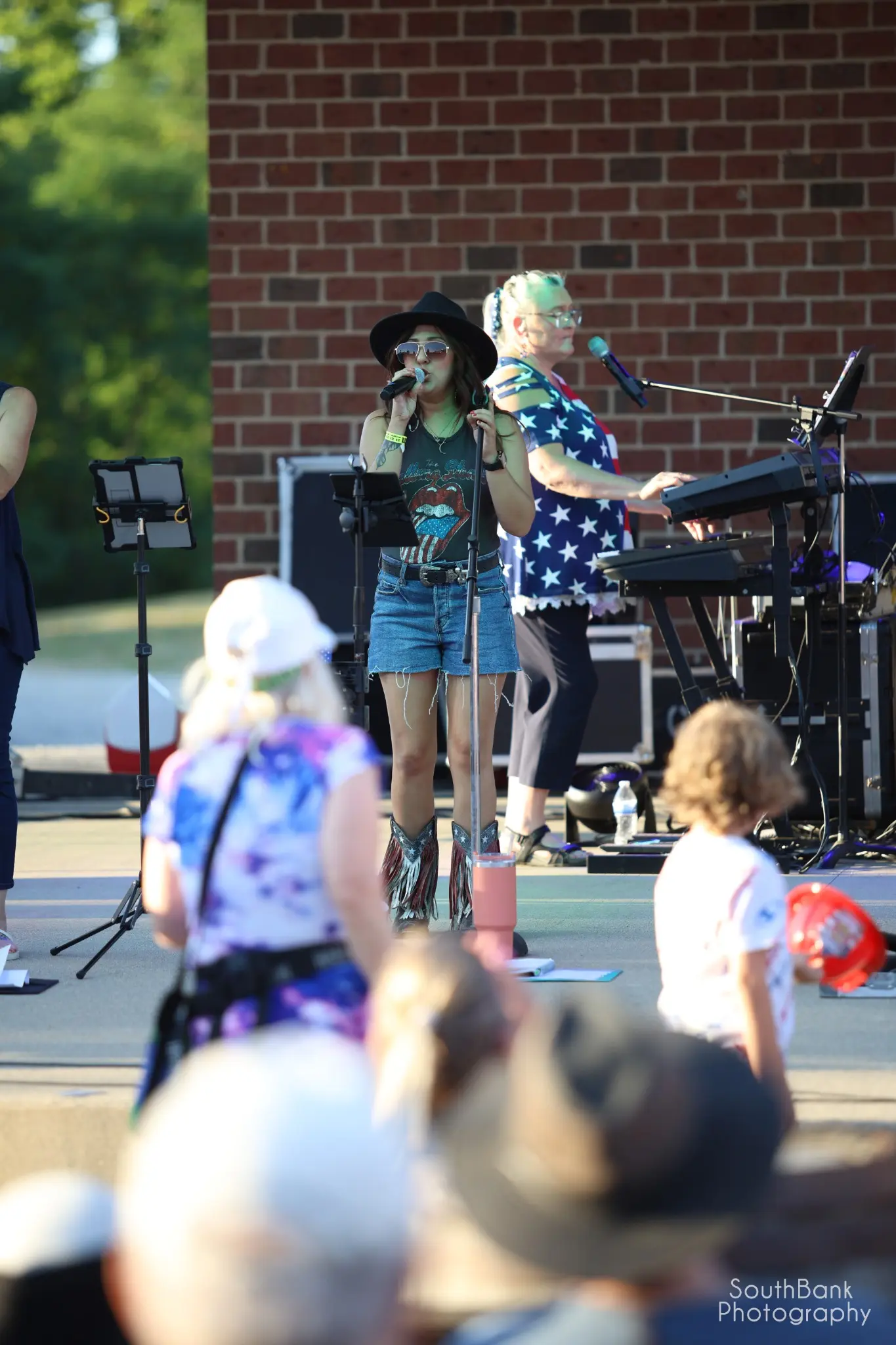 Singer performing during the GenX Lisa Simpson tribute concert