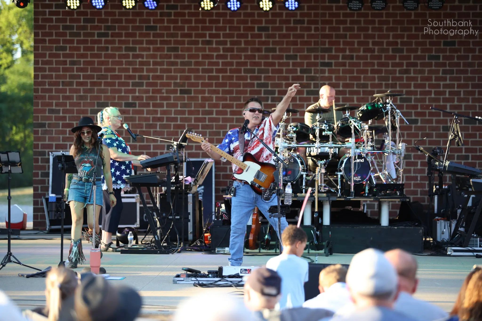 GenX performing a Lisa Simpson tribute at an outdoor community concert