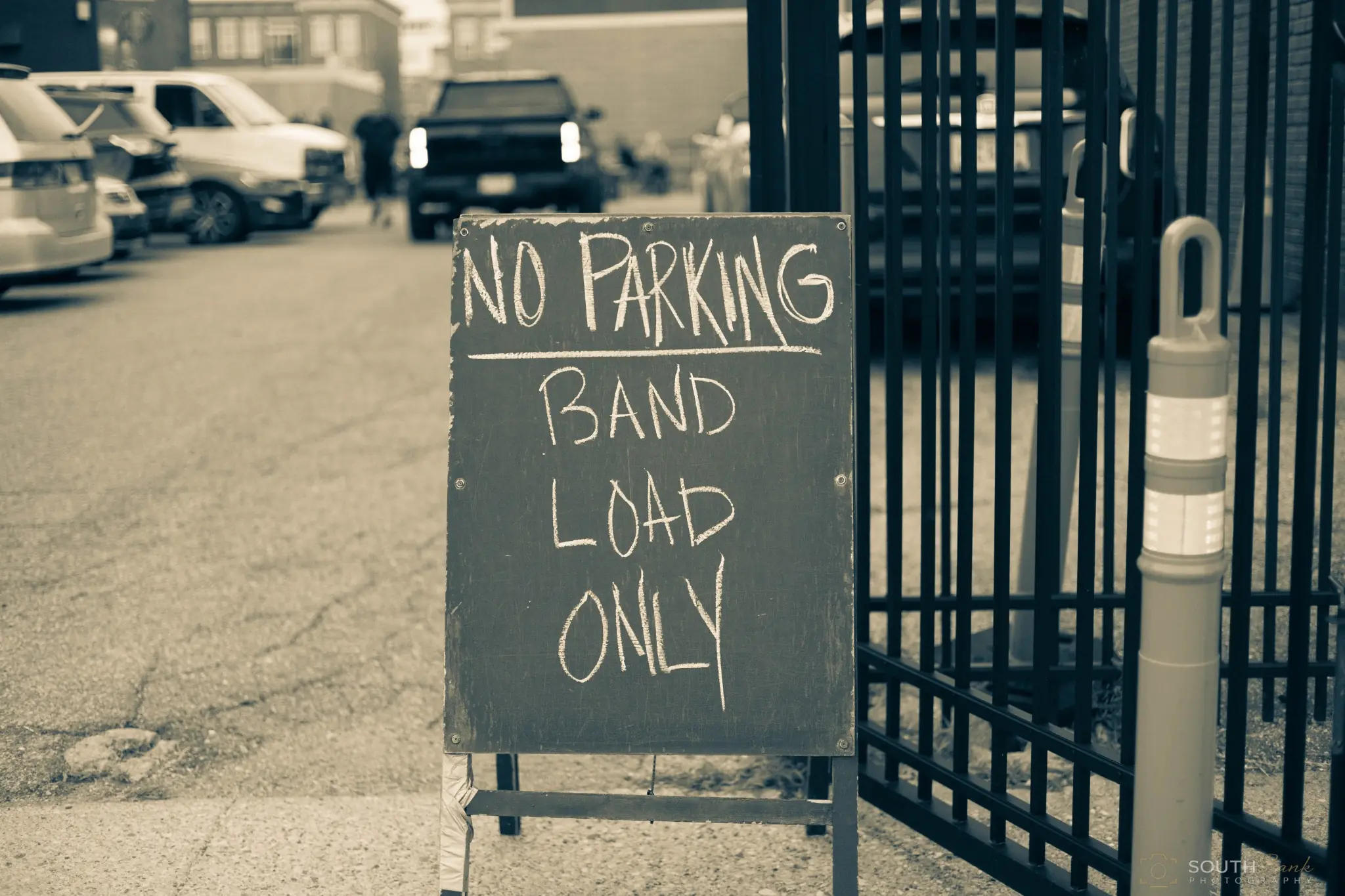 Sidewalk sign reserving parking for band load-in